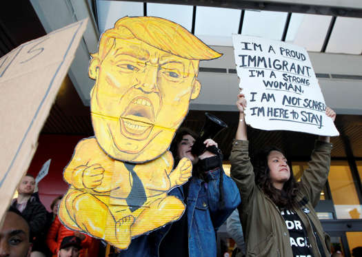 Slide 3 of 26: Protestors crowd the sidewalks at HartsfieldJackson Atlanta International Airport on Jan. 29, 2017