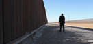 A U.S. Border Patrol agent stands at the U.S.-Mexico border fence on November 17, 2016 in San Luis, Arizona.