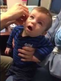 Toddler hears parents' voices first