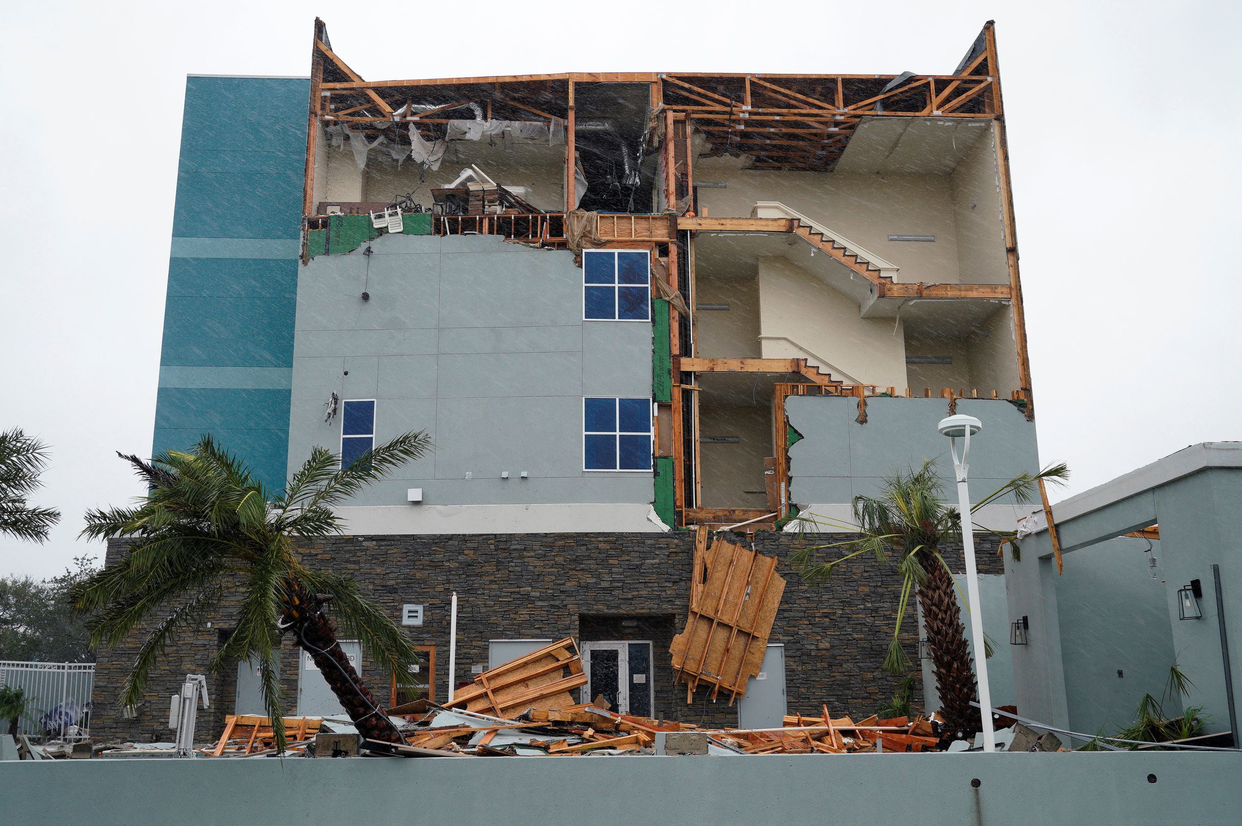 Slide 11 of 77: The end wall of the Fairfield Inn is seen partially missing after Hurricane Harvey struck in Rockport, Texas, August 26, 2017.