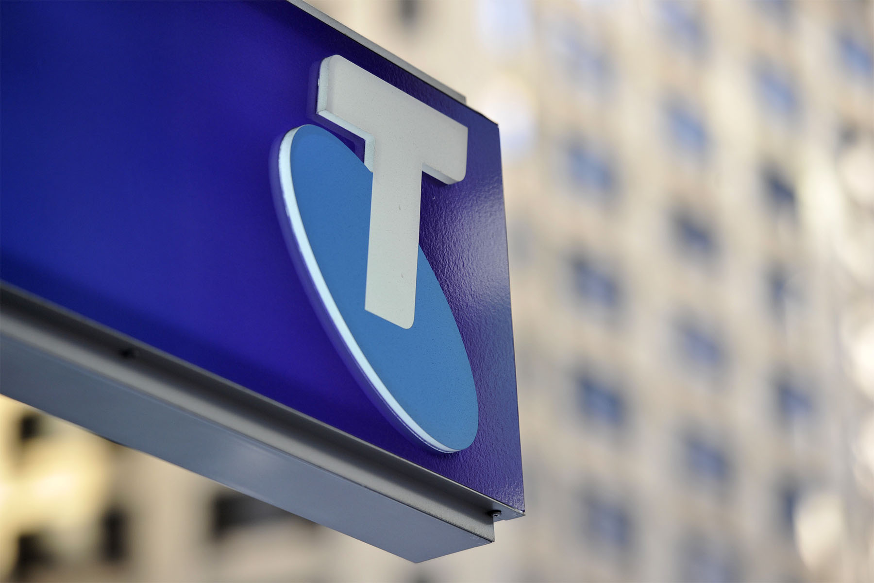 Telstra shares slump dividend slashed