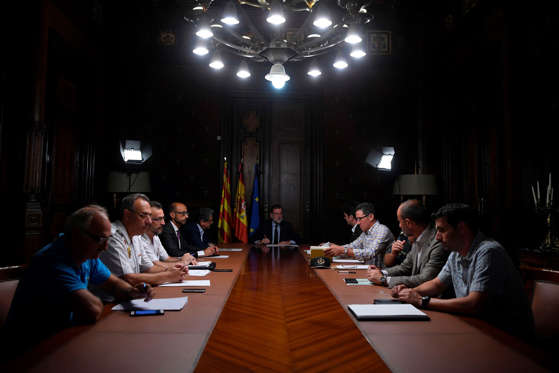 Slide 1 of 30: Spanish Prime Minister Mariano Rajoy, center, speaks during a meeting following the attack of Barcelona where a van ploughed into the crowd, killing 13 persons and injuring over 80 on the Rambla in Barcelona, on August 17, 2017.