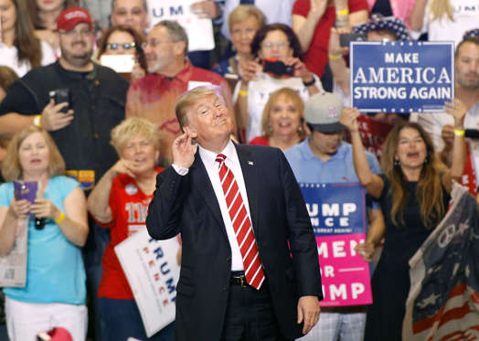 Slide 23 of 27 US President Donald Trump gestures during a rally at the Phoenix Convention Center on August 22 2017 in Phoenix Arizona An earlier statement by the president that he was considering a pardon for Joe Arpaio the former sheriff of Maricopa County who was convicted of criminal contempt of court for defying a court order in a case involving racial profiling has angered Latinos and immigrant rights advocates