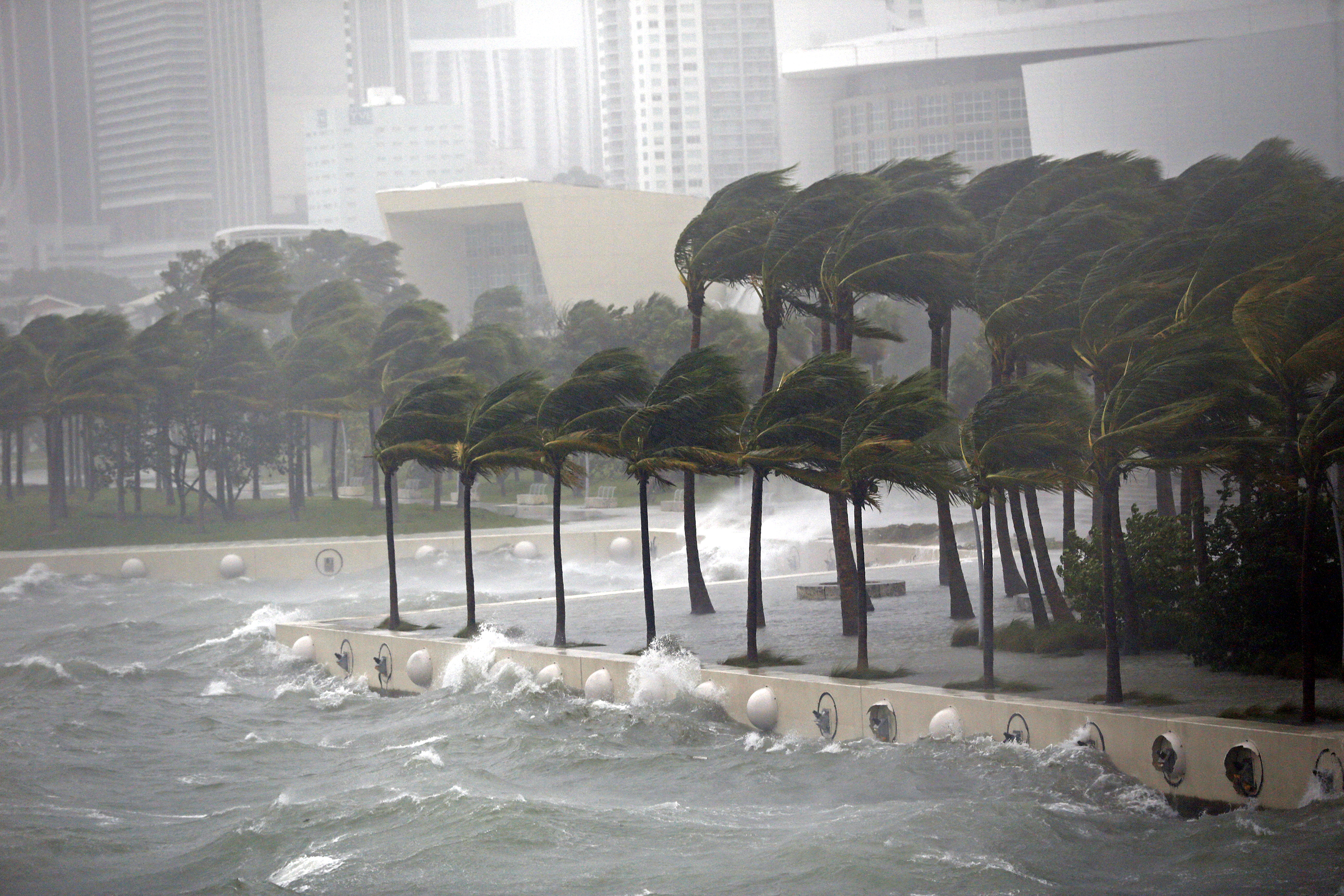 Waves crash over a seawall from Biscayne Bay as Hurricane Irma passes by on Sept. 10, 2017, in Miami.