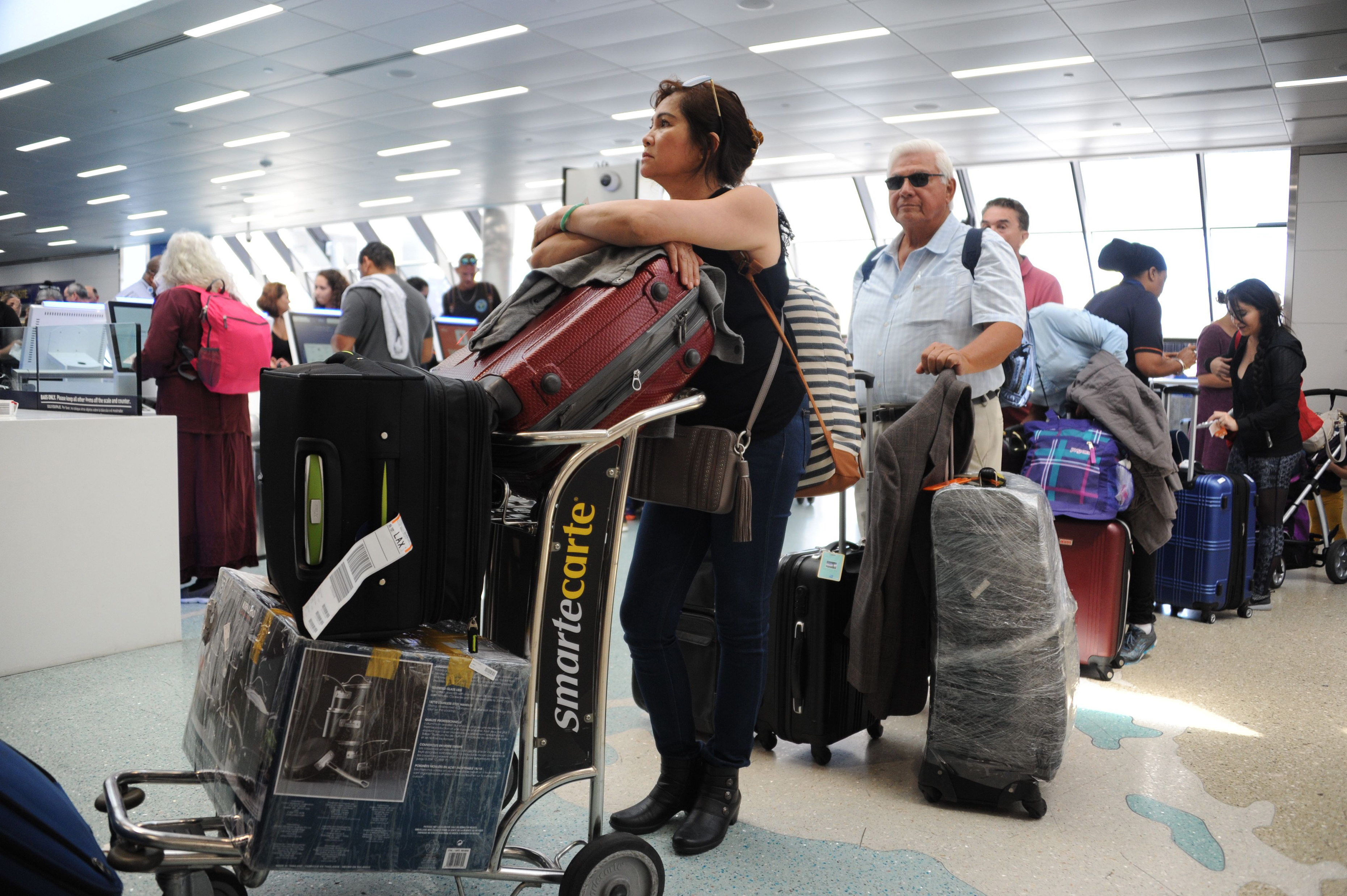 People crowd Fort Lauderdale International Airport as evacuation is underway for the arrival of Hurricane Irma, September 7, 2017 in Fort Lauderdale, Florida. Hurricane Irma, one of the most powerful Atlantic storms on record, cut a deadly swath through a string of small Caribbean islands and was on a collision course with Puerto Rico and potentially south Florida.