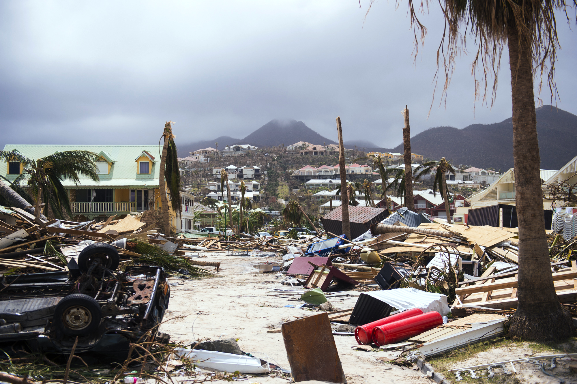 A photo taken on September 7, 2017 shows damage in Orient Bay on the French Carribean island of Saint-Martin, after the passage of Hurricane Irma. France, the Netherlands and Britain on September 7 rushed to provide water, emergency rations and rescue teams to territories in the Caribbean hit by Hurricane Irma, with aid efforts complicated by damage to local airports and harbours. The worst-affected island so far is Saint Martin, which is divided between the Netherlands and France, where French Prime Minister Edouard Philippe confirmed four people were killed and 50 more injured.