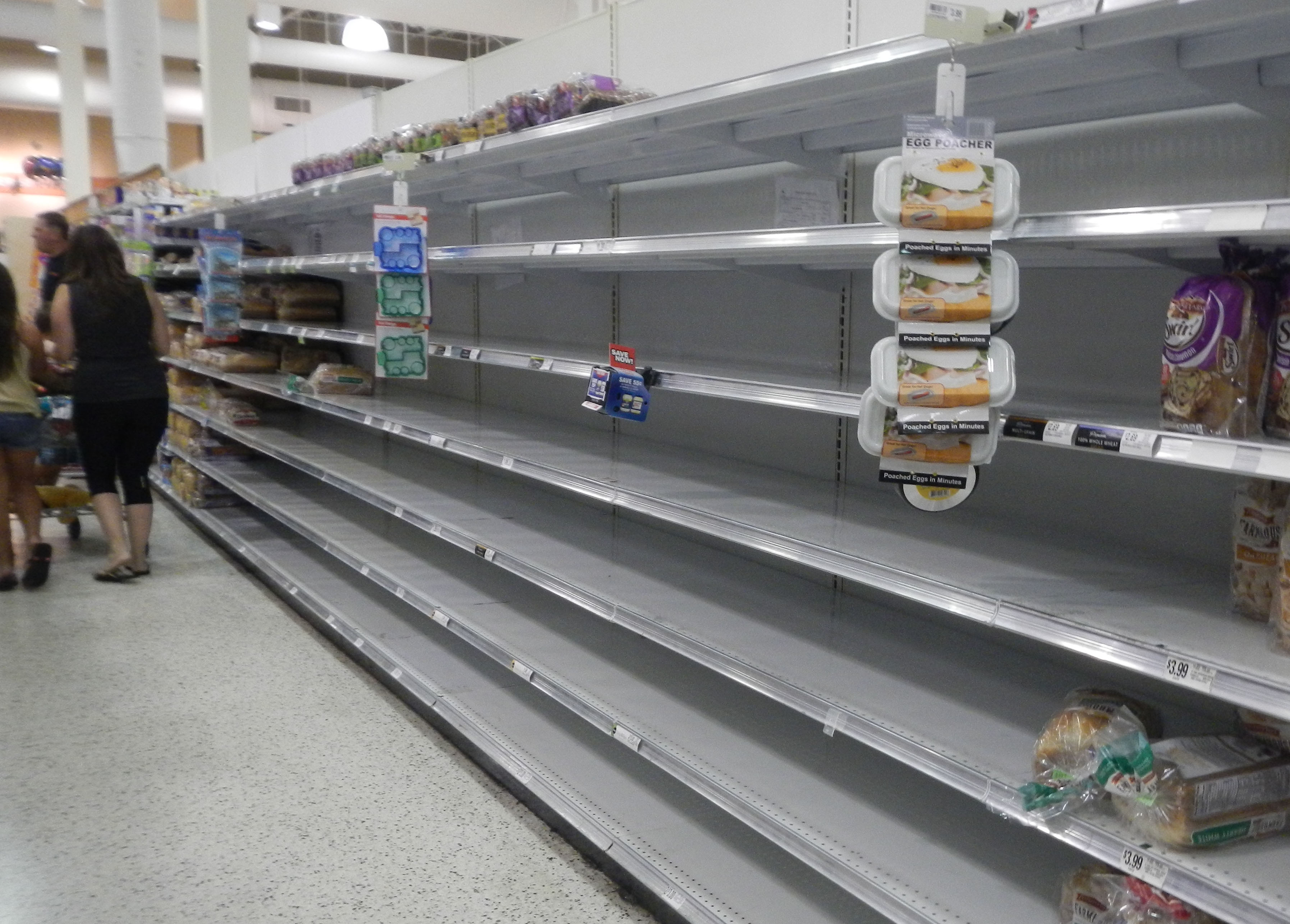 As Hurrcane Irma approaches Florida September 8, 2017 shoppers in Port St. John, near Kennedy Space Center, find almost empty bread shelves. Warning that Irma would be worse than Hurricane Andrew, which killed 65 people in 1992, Florida's governor said all of the state's 20.6 million inhabitants should be prepared to evacuate.