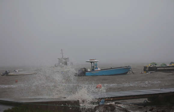 Slide 4 of 20: Boats remain anchored in a wharf as Hurricane Maria approaches in Guadeloupe island, France, September 18, 2017.