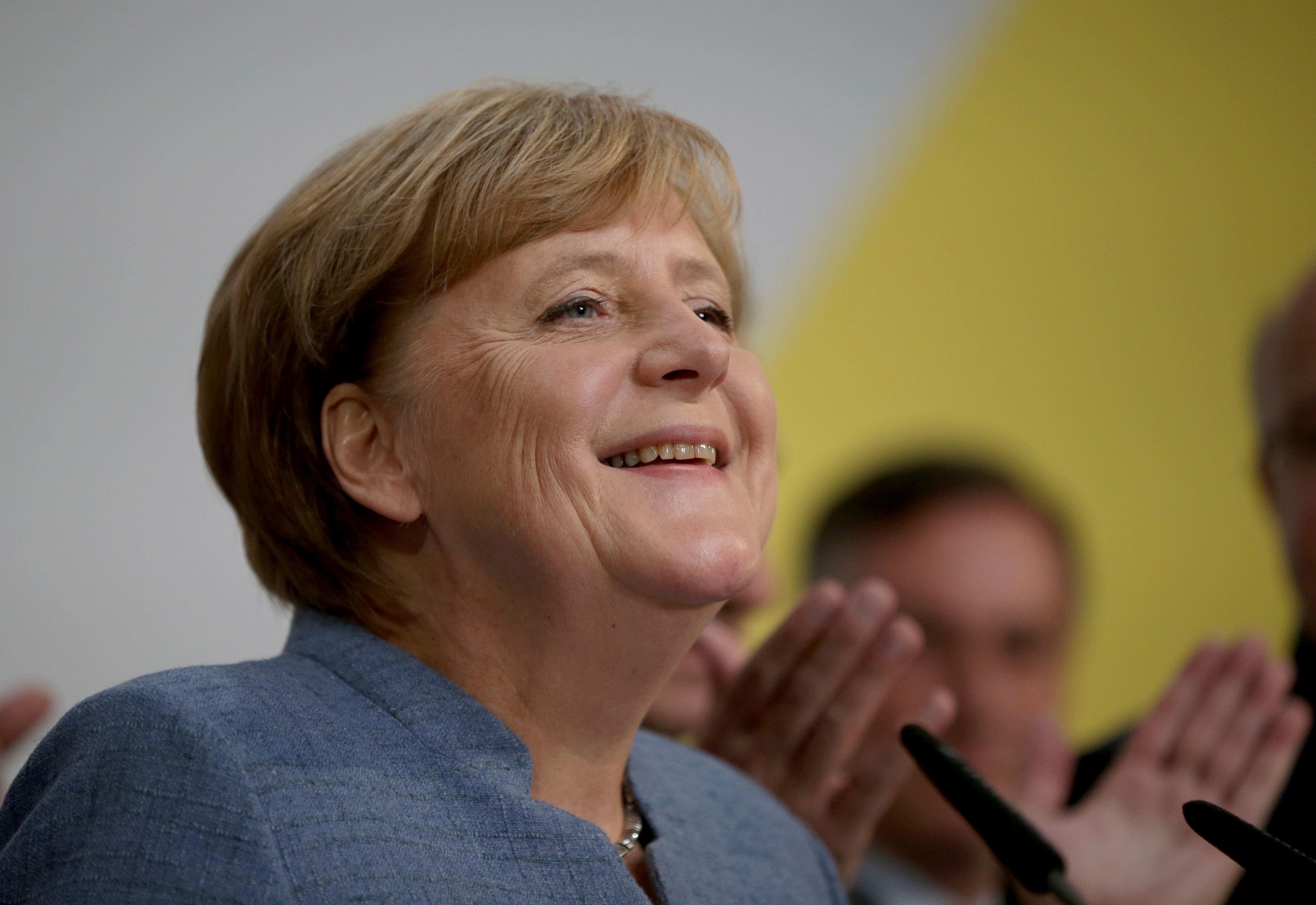 Merkel wins 4th term but nationalists surge in German vote