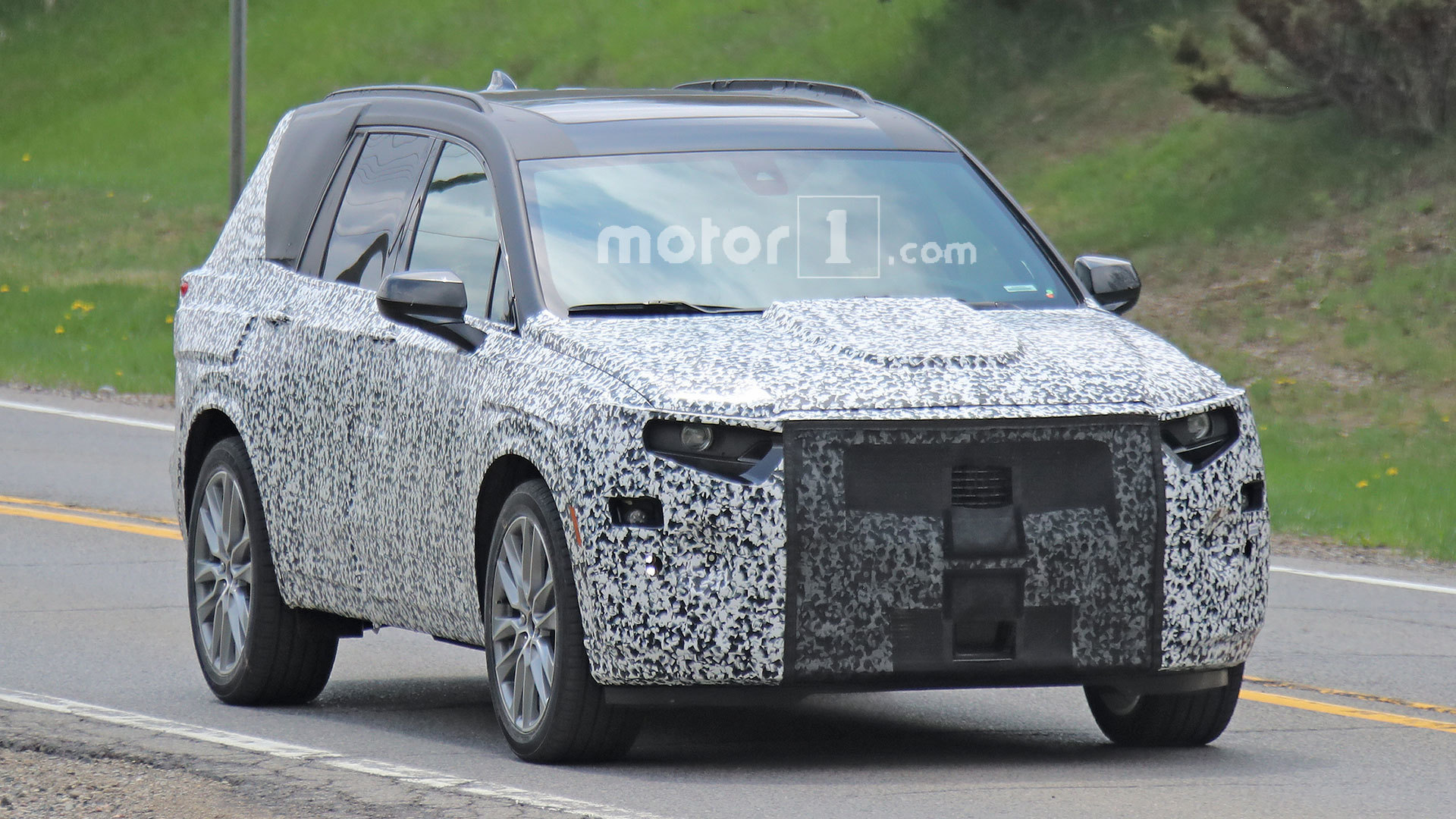Cadillac spied still covered thick