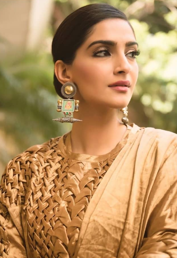 Sonam adds twist gold saree