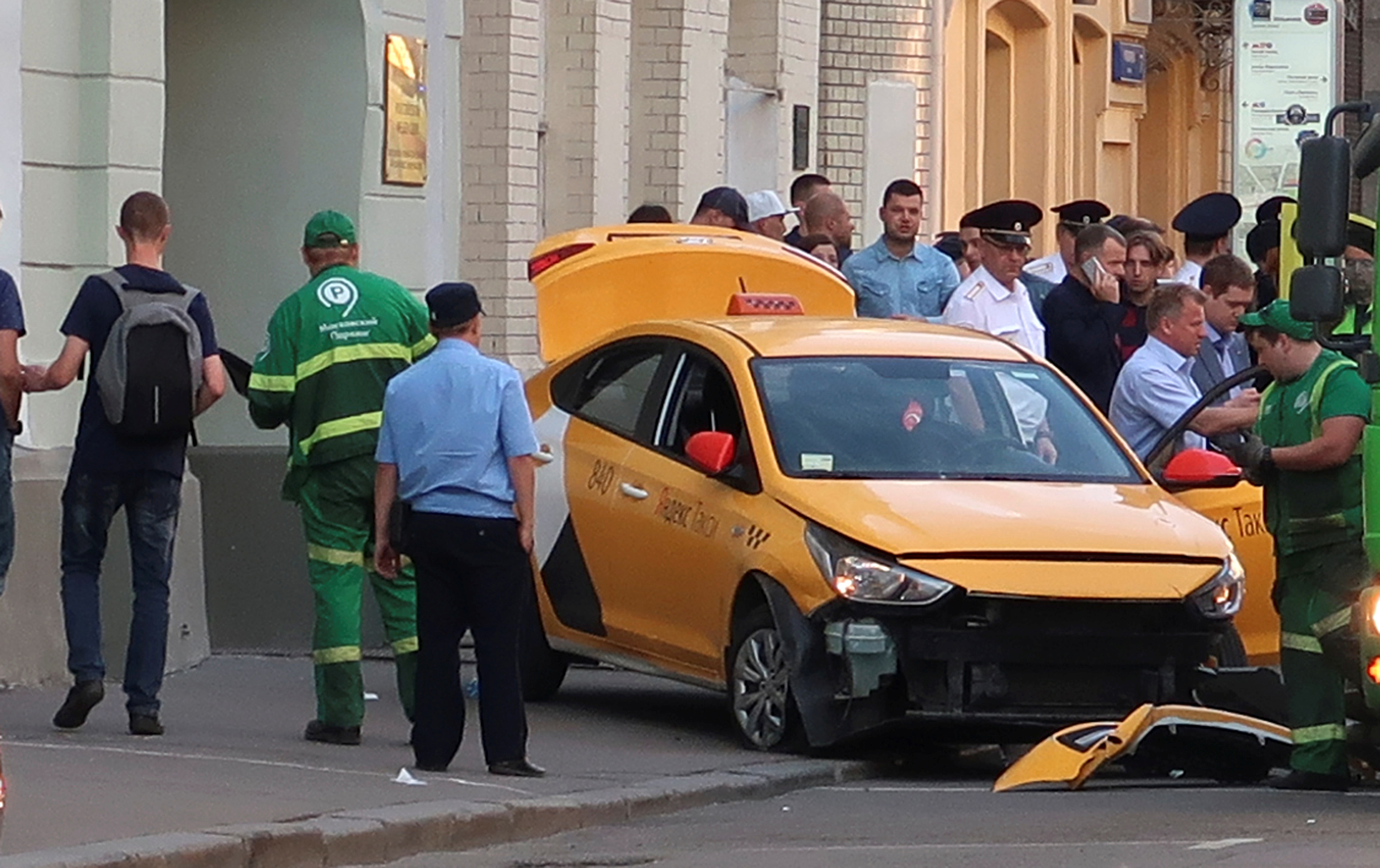 Taxi crashes into World fans