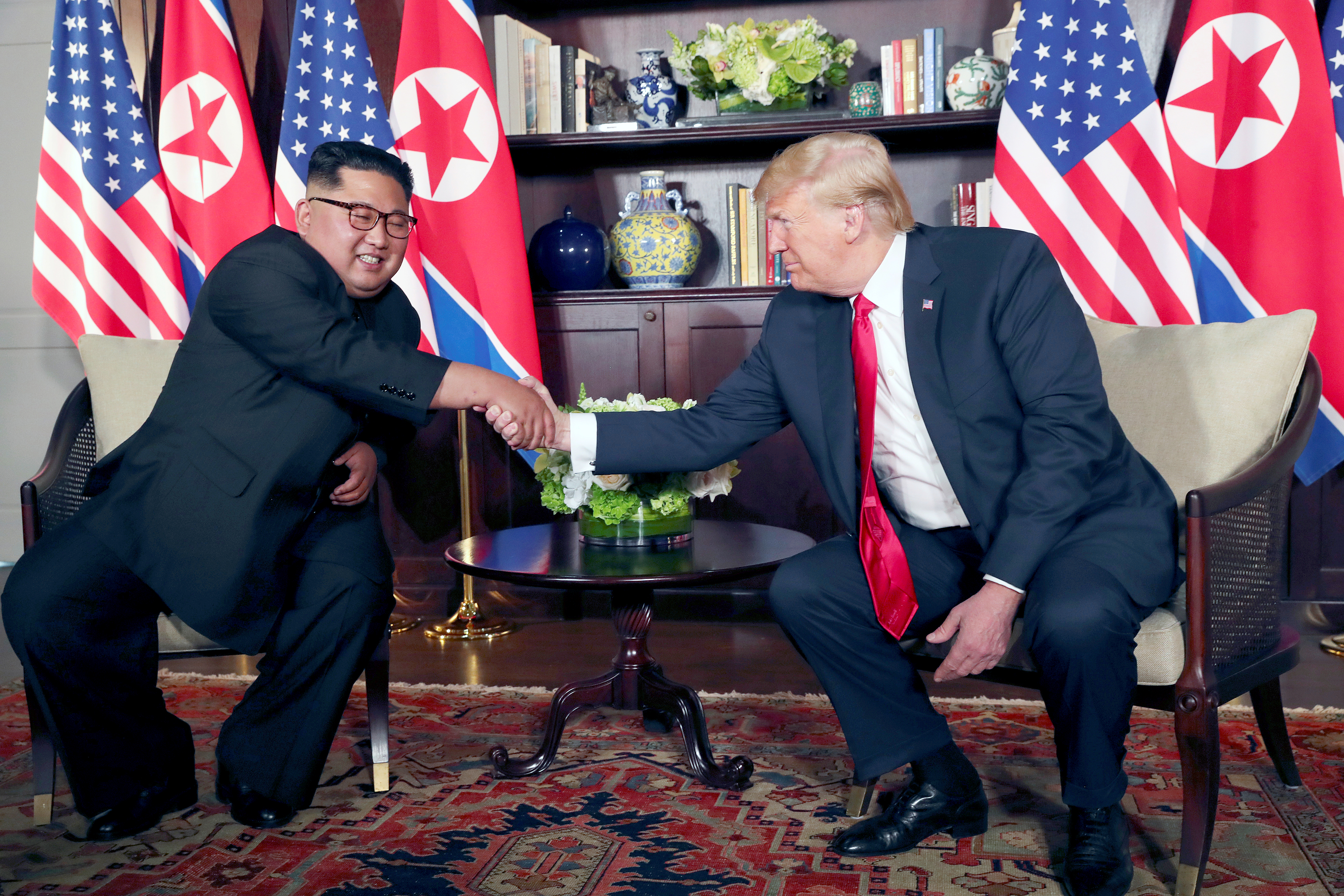 different handshakes Donald Trump