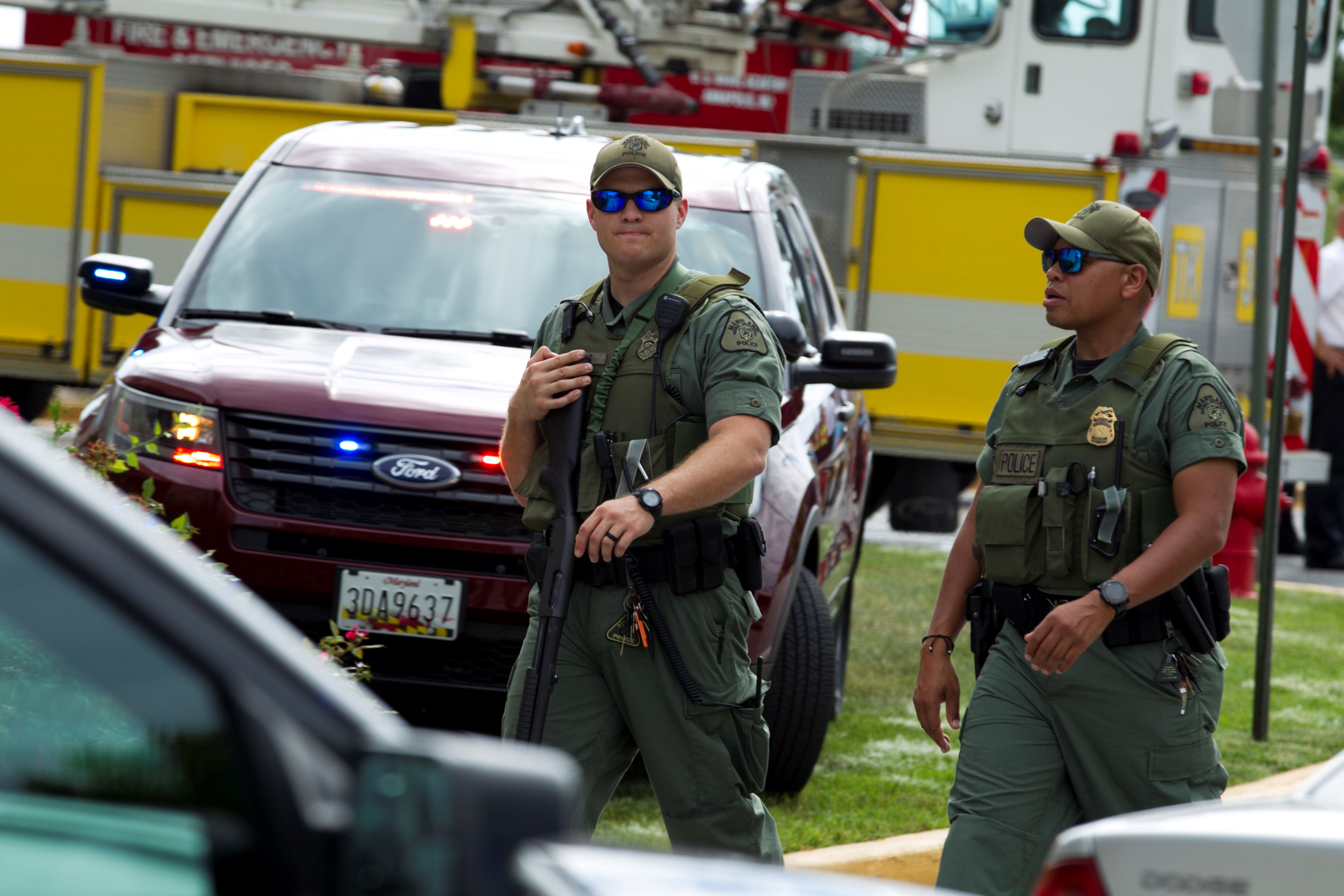 Police: killed shooting newspaper building
