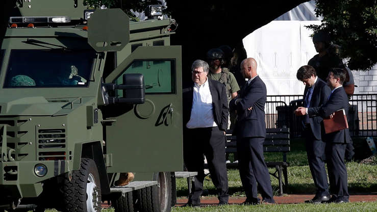 a group of people standing in front of a truck: Attorney General William P. Barr on Monday outside the White House. He gave the order to disperse the demonstrators.