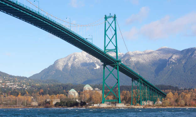 Slide 2 of 31: Linking the city of Vancouver to North Vancouver, the sprawling Lions Gate Bridge has been a West Coast landmark since it opened in 1938. The road leading to the bridge cuts through leafy Stanley Park, a remarkably controversial route at the time of the bridge’s construction. The bridge is named after “the Lions,” a pair of nearby mountain peaks, and its south entrance also features two concrete lion sculptures by artist Charles Marega.