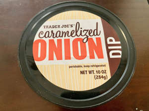 a close up of a sign: Trader Joe's caramelized-onion dip was one of the best. Savanna Swain-Wilson