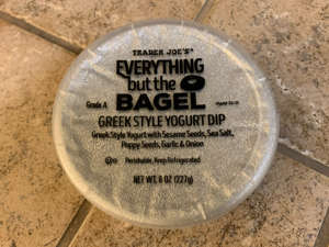 a close up of a sign: Trader Joe's Everything but the Bagel Greek-yogurt dip uses the chain's iconic seasoning blend. Savanna Swain-Wilson for Insider