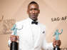 Mahershala Ali holding a glass of wine: Simon Helberg wasn’t the only star to share their opinion on Trump’s Muslim Ban that night as the ‘Moonlight’ star used his acceptance speech for Best Male Actor in a Supporting Role award to share how he felt as a Muslim following the ban.  He said: “My mother is an ordained minister. I am a Muslim. She didn’t do backflips when I called her and told her I converted 17 years ago. But I tell you now, we put things to the side, and I was able to see her. She is able to see me. We love each other. The love has grown, and that stuff’s minutia. It’s not that important.”
