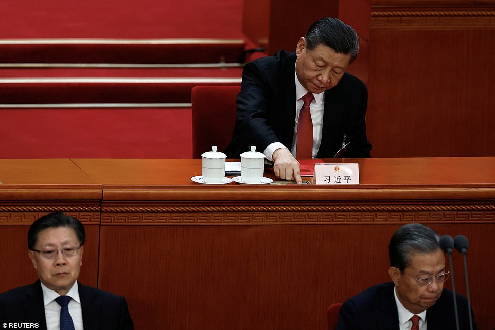 Xi Jinping Appears To Wince After Sipping Brew At Annual Congress