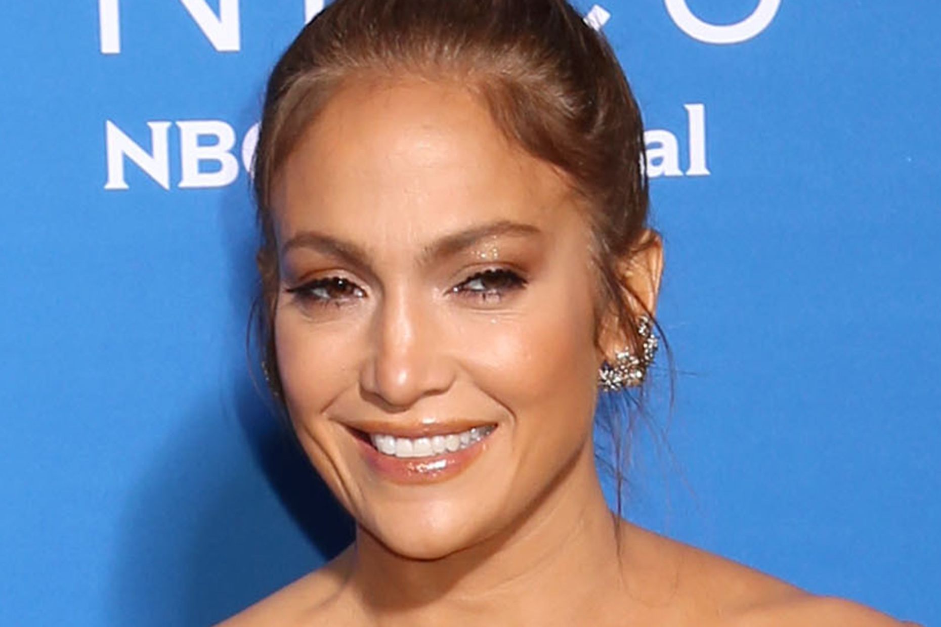 J-Lo turns heads plunging shoulder-baring