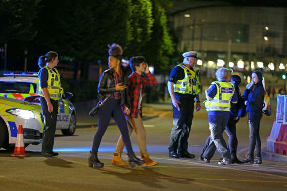 Police and fans close to the Manchester Arena - Dave Thompson/Getty Images Slide 27 of 27: Police and fans close to the Manchester Arena on May 23, 2017 in Manchester, England. There have been reports of explosions at Manchester Arena where Ariana Grande had performed this evening. Greater Manchester Police have have confirmed there are fatalities and warned people to stay away from the area.
