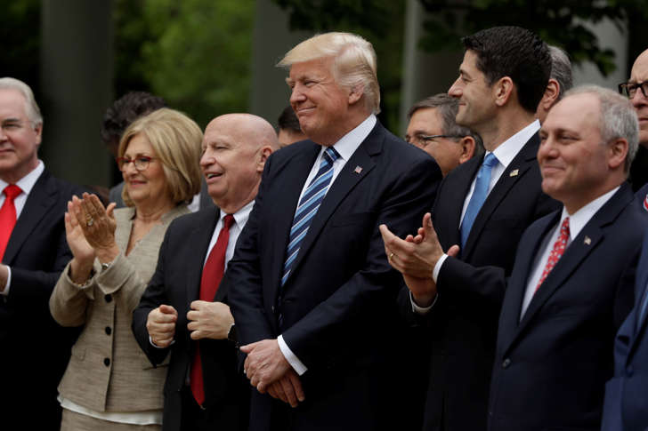 FILE: President Donald Trump, flanked by House Ways and Means Committee Chairman Rep. Kevin Brady, R-Texas, and House Speaker Paul Ryan of Wis., are seen in the Rose Garden of the White House in Washington, Thursday, May 4, 2017, after the House pushed through a health care bill.