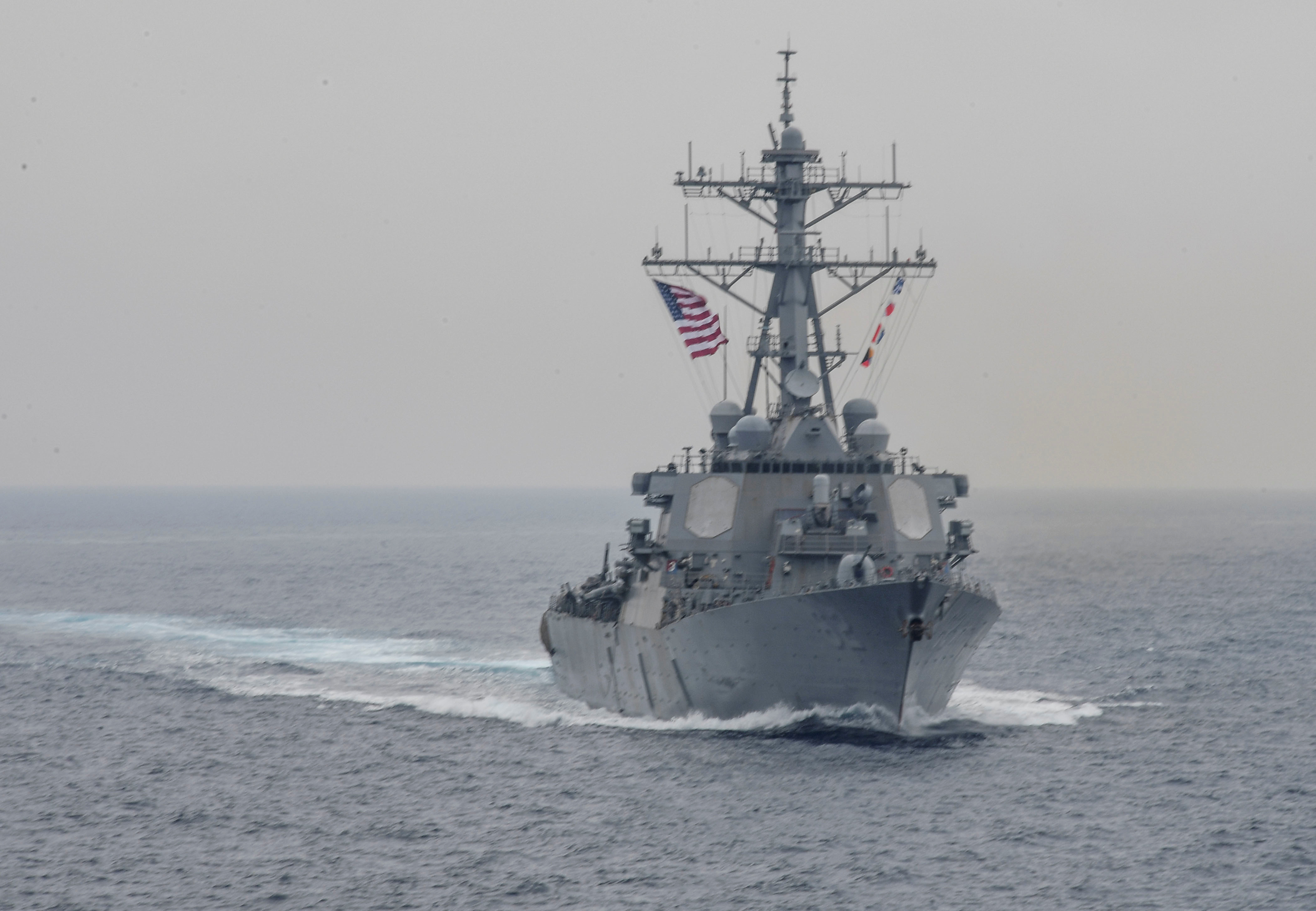 The Arleigh Burke-class guided-missile destroyer USS Fitzgerald sails in formati...