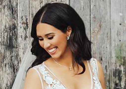 Bride wears pink while bridesmaids