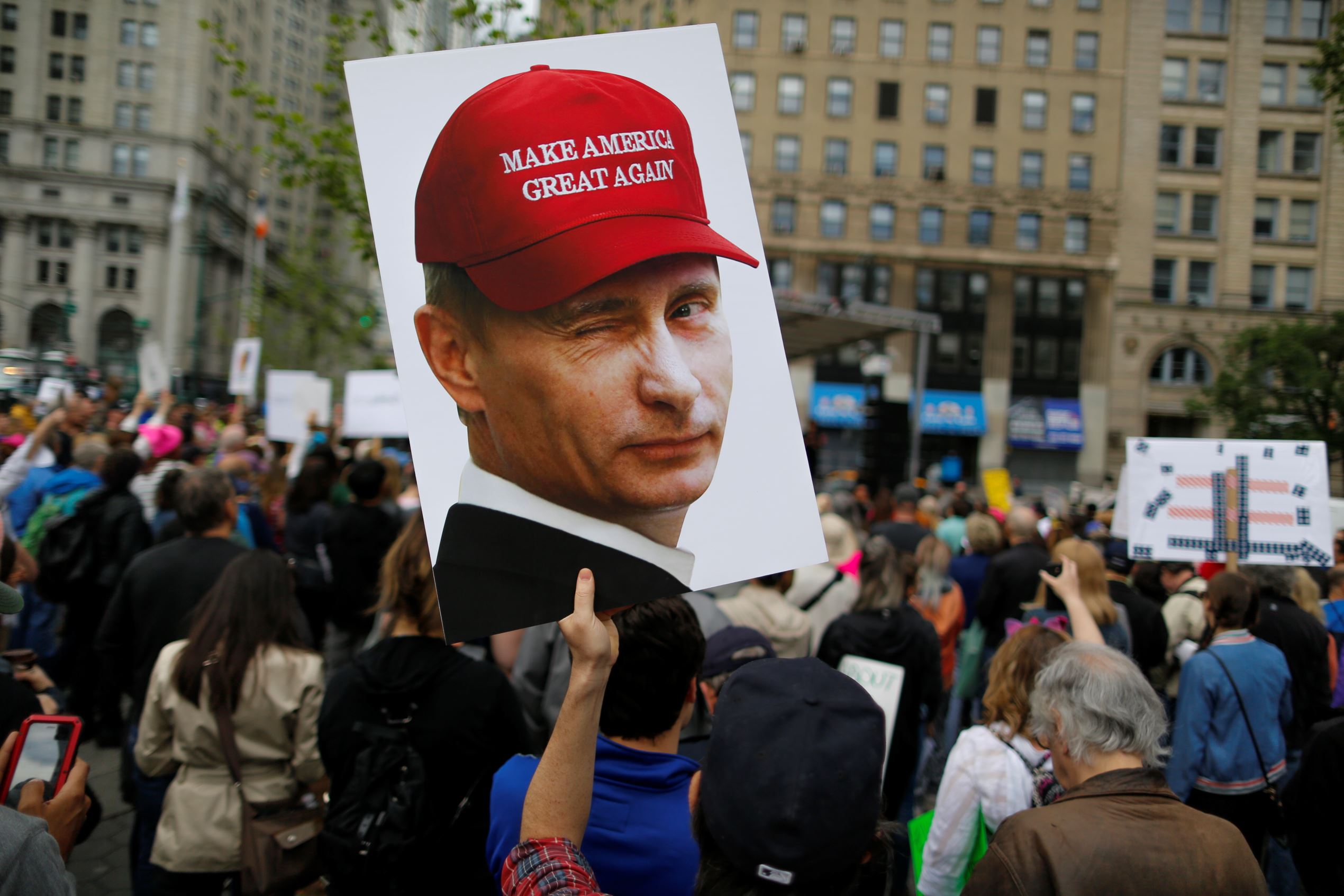 Slide 10 de 36: NEW YORK, NY - JUNE 03: A demonstrator holds up a sign of Vladimir Putin during an anti-Trump 'March for Truth' rally on June 3, 2017 in New York City. Rallies and marches are taking place across the country to call for urgent investigation into possible