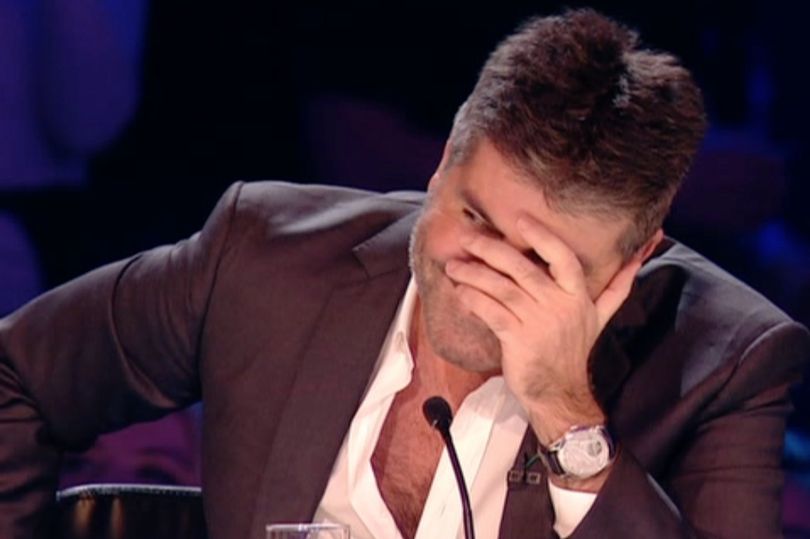 Simon Cowell gets slapped crossing