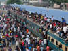 Bangladeshi homebound people try to climb on the roof of an overcrowded train as they head to their hometowns ahead of the Muslim holiday of Eid al-Fitr, in Dhaka, Bangladeshon June 24, 2017. Dhaka, Bangladesh. &nbsp;