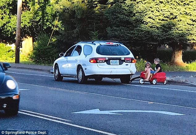 Mother arrested towing kids plastic
