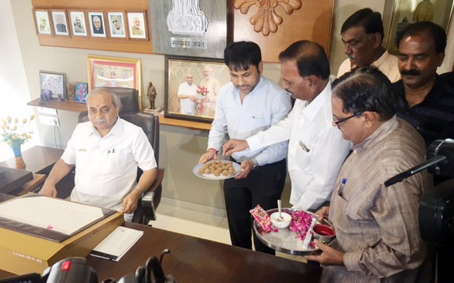 'Upset' Nitin Patel takes charge