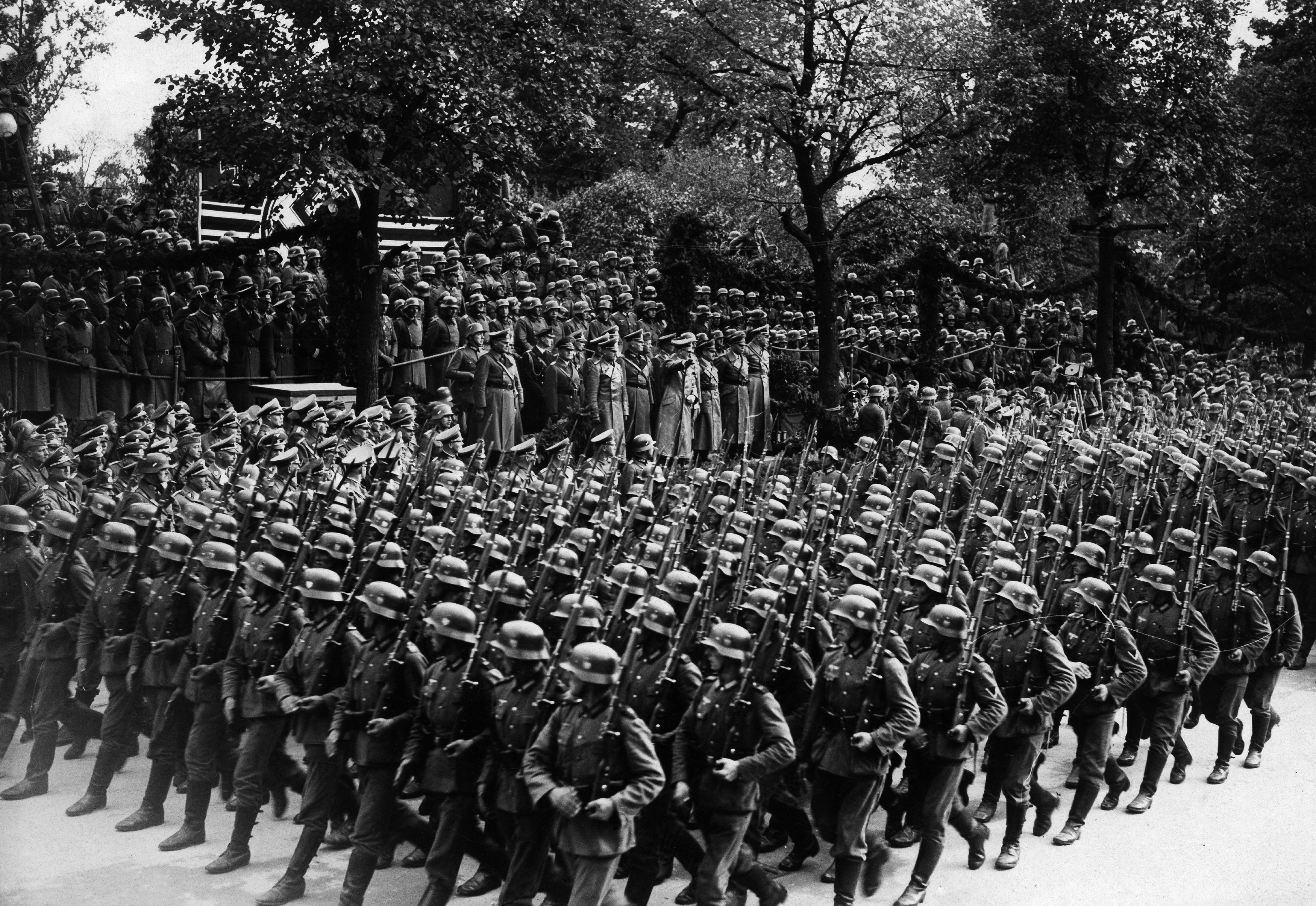 Slide 1 of 30: (Eingeschränkte Rechte für bestimmte redaktionelle Kunden in Deutschland. Limited rights for specific editorial clients in Germany.) Poland Second World War: marching soldiers in front of Adolf Hitler on the Ujazdowski-Allee in Warsaw- Published by 'Berliner Morgenpost' 06.10.1939- Photographer: Presse-Illustrationen Heinrich Hoffmann (Photo by Heinrich Hoffmann/ullstein bild via Getty Images)