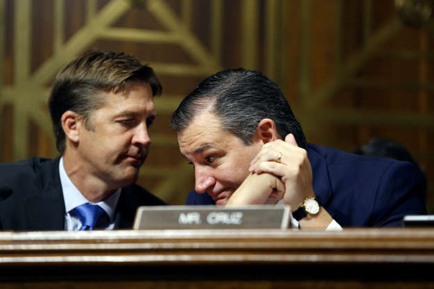 Slide 3 of 80: Senator Benjamin E. Sasse (R-NE) and Senator Ted Cruz (R-TX) talks as Dr. Christine Blasey Ford speaks before the Senate Judiciary Committee hearing on the nomination of Brett Kavanaugh to be an associate justice of the Supreme Court of the United States, on Capitol Hill September 27, 2018 in Washington, DC. A professor at Palo Alto University and a research psychologist at the Stanford University School of Medicine, Ford has accused Supreme Court nominee Judge Brett Kavanaugh of sexually assaulting her during a party in 1982 when they were high school students in suburban Maryland.