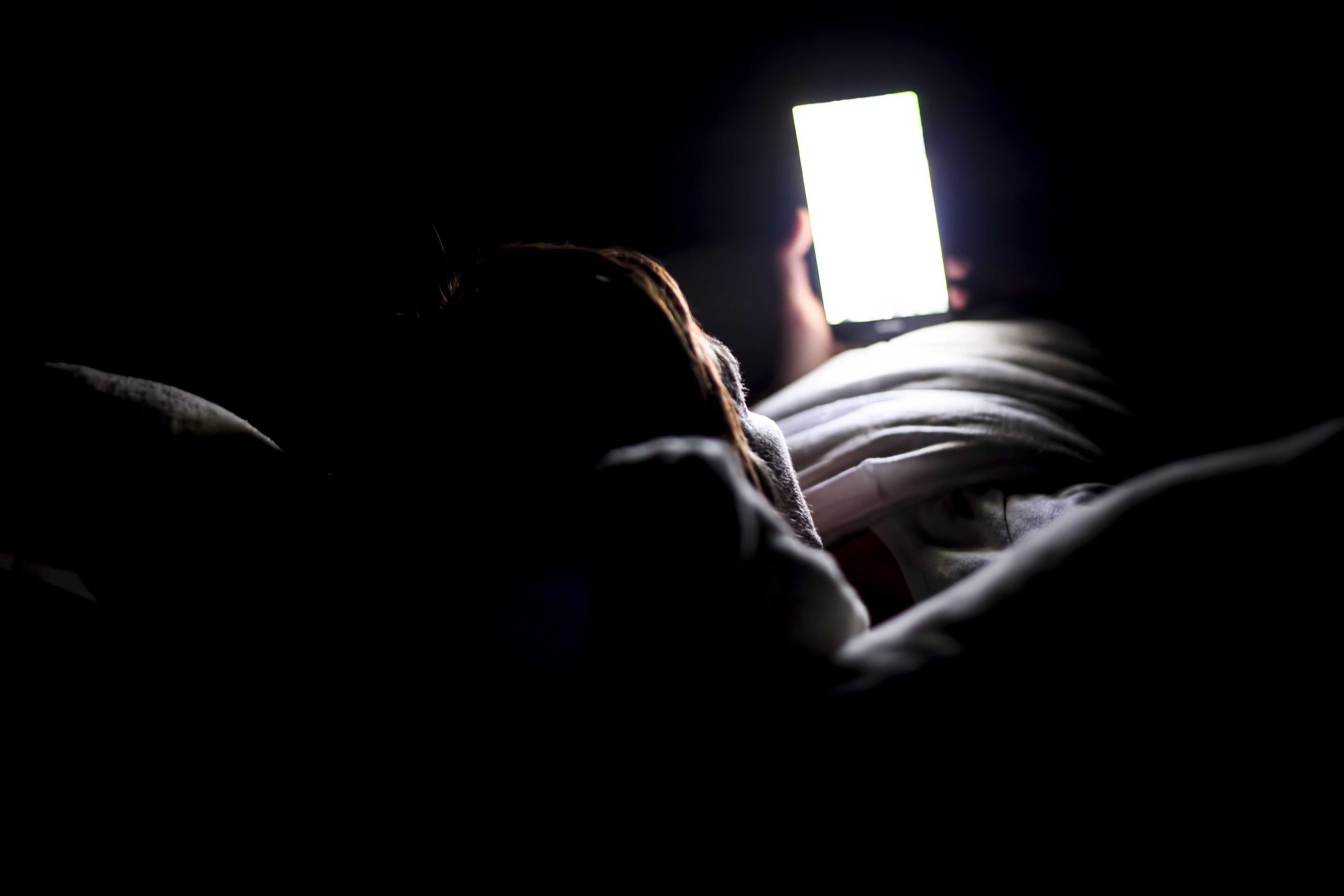 The blue light from our phones mimics daylight and inhibits the development of sleep hormone melatonin