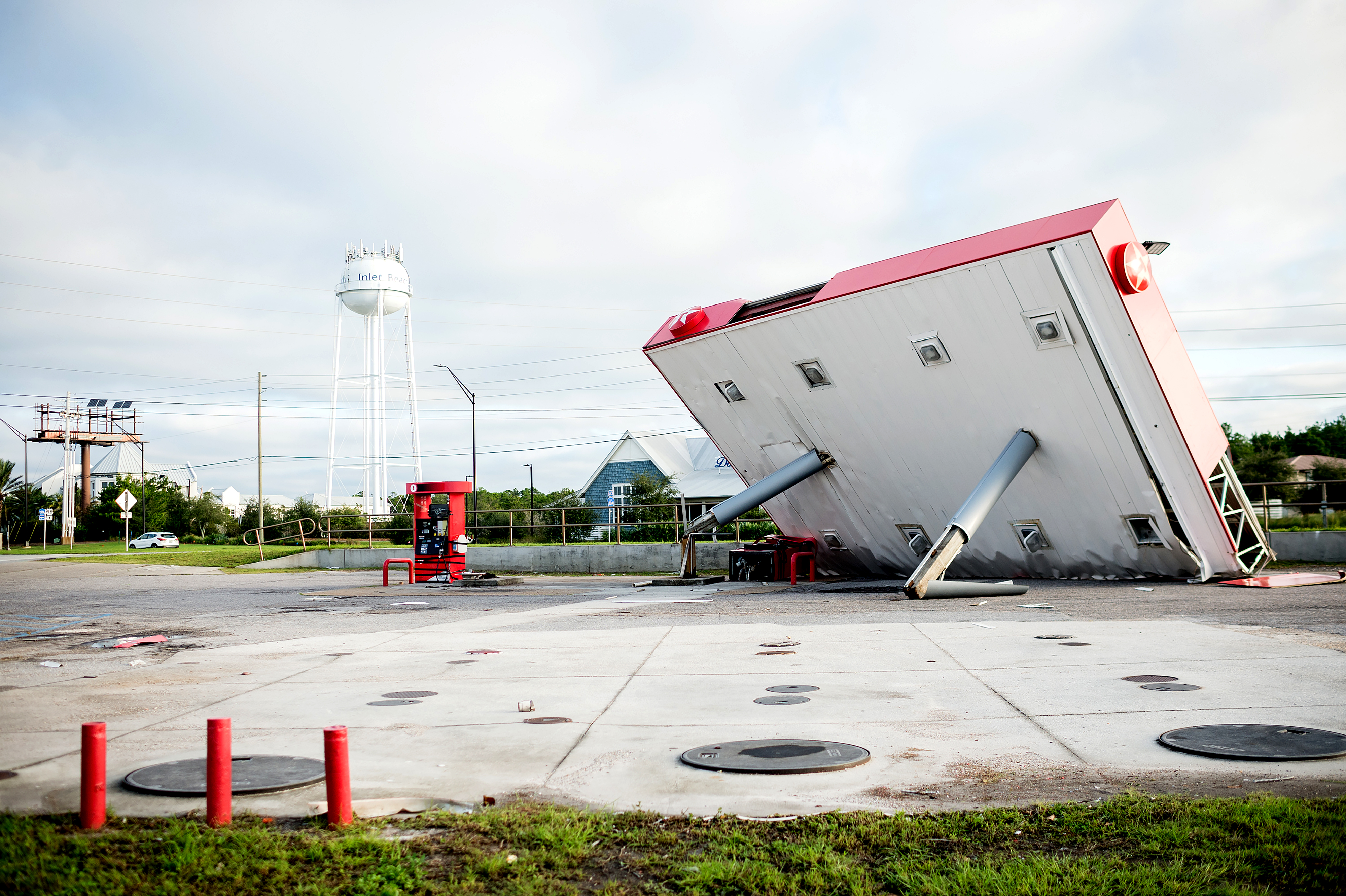 Slide 1 of 69: The overhang of a gas station is toppled over in the aftermath of Hurricane Michael on October 11, 2018 in  Inlet Beach, Florida. - Residents of the Florida Panhandle woke to scenes of devastation Thursday after Michael tore a path through the coastal region as a powerful hurricane that killed at least two people