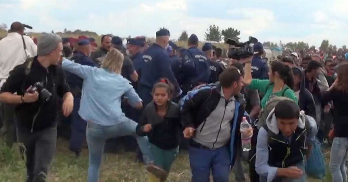 Camerawoman acquitted over migrant kick