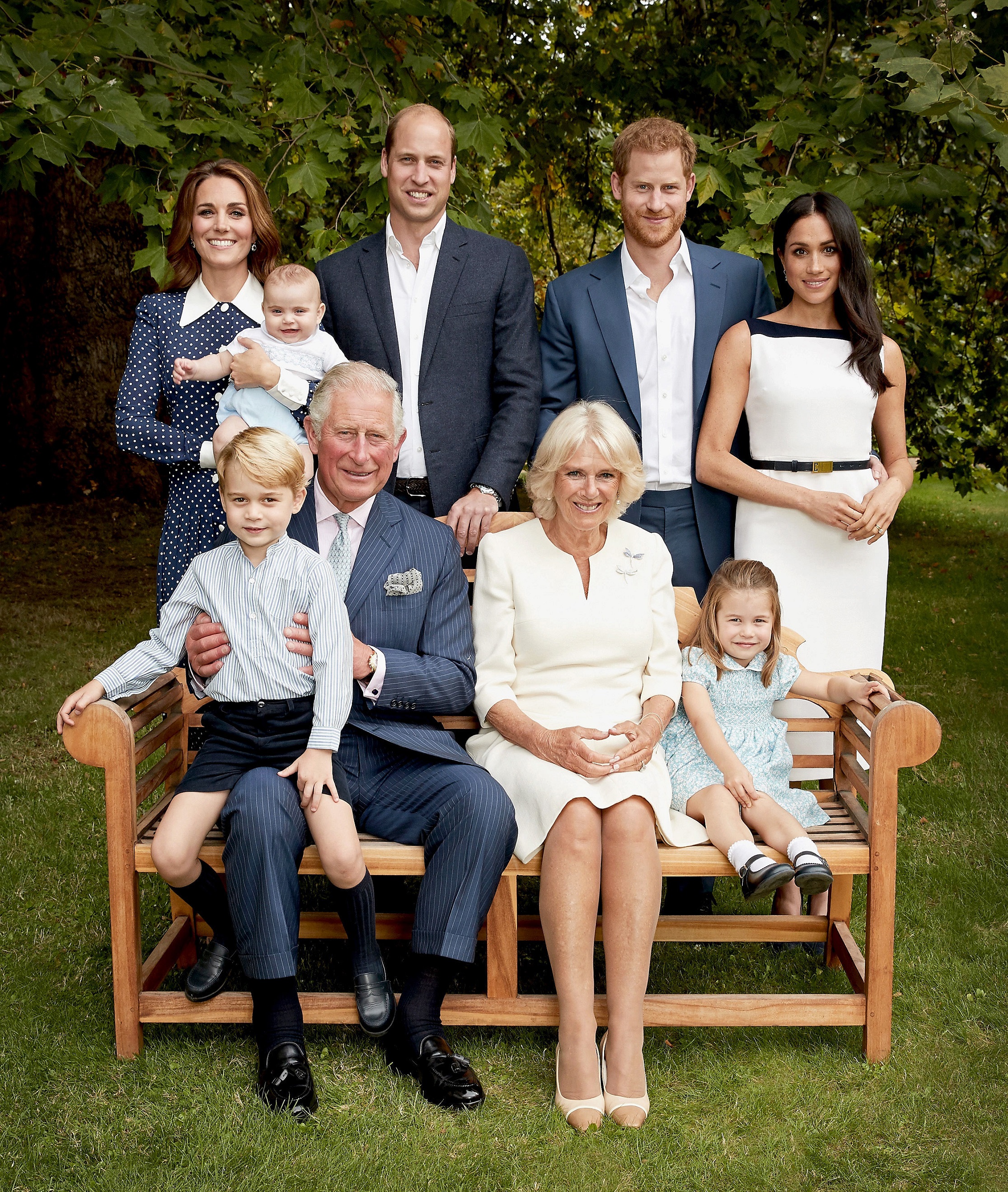 No sales Strictly for editorial use only not for use after December 12th 2018 Handout image provided by Clarence House of (Back row left to right) Prince Louis, the Duchess of Cambridge, the Duke of Cambridge, the Duke of Sussex and the Duchess of Sussex. (front row left to right) Prince George, the Prince of Wales, the Duchess of Cornwall and Princess Charlotte, in the gardens of Clarence House, in an official photograph to celebrate the The Prince of Wales 70th birthday.