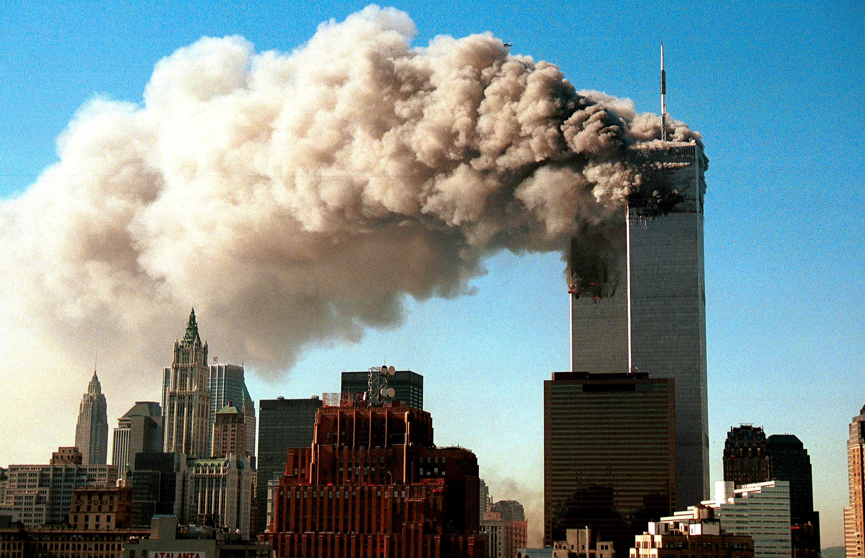 Smoke pours from the twin towers of the World Trade Center after they were hit by two hijacked airliners in a terrorist attack September 11, 2001 in New York City.