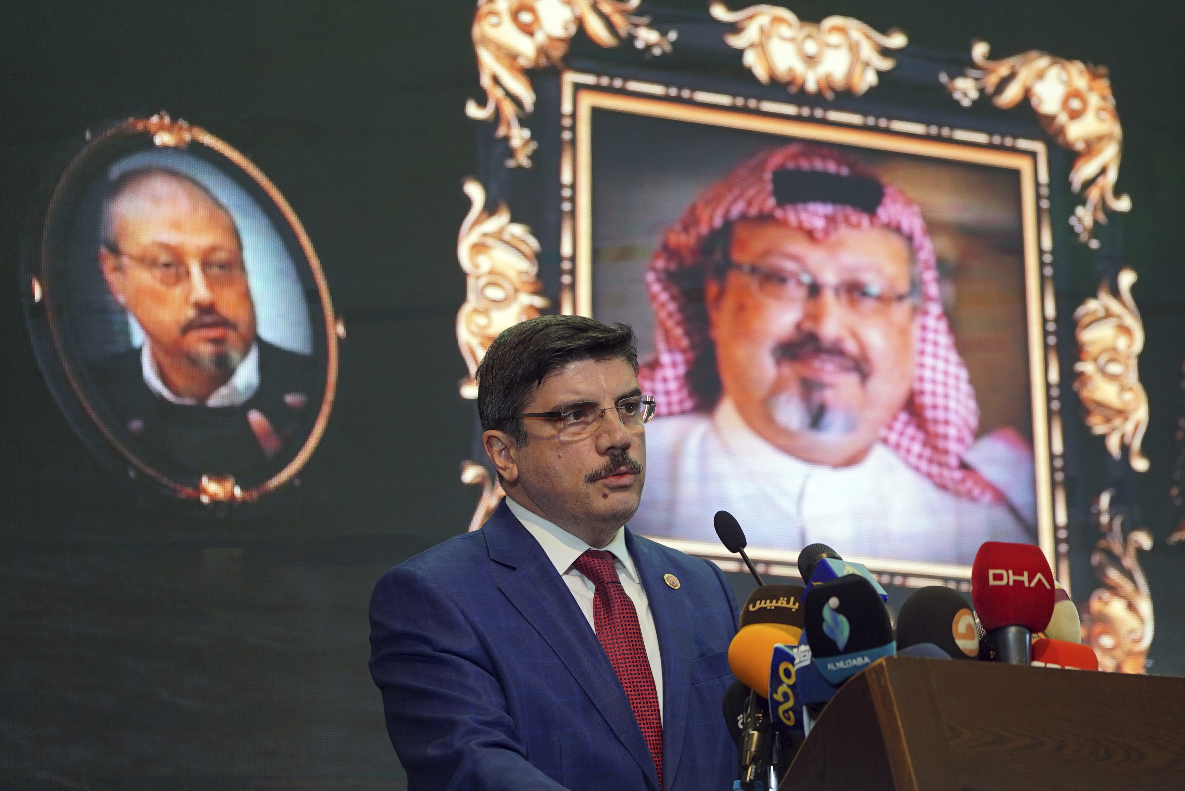 Yasin Aktay, an advisor to Turkey's President Recep Tayyip Erdogan, speaks during an event organized to mark the 40th day of the death of Saudi writer Jamal Khashoggi, background, in Istanbul, Turkey. Saud Al-Mojeb, Saudi Arabia’s top prosecutor, is recommending the death penalty for five suspects charged with ordering and carrying out the killing of Saudi writer Jamal Khashoggi. Al-Mojeb told a press conference in Riyadh Thursday, Nov. 15, 2018,  that Khashoggi’s killers had been planning the operation since September 29, three days before he was killed inside the kingdom’s consulate in Istanbul. (AP Photo/Neyran Elden, File)