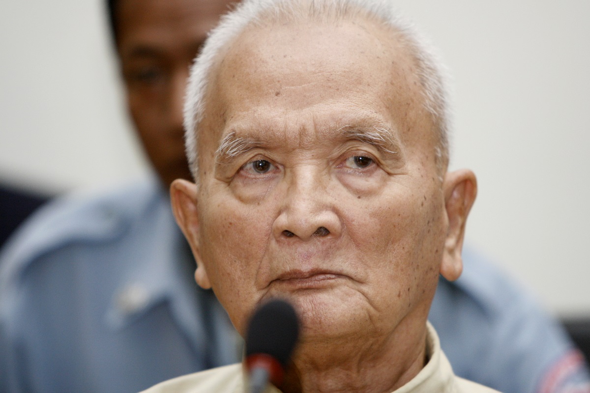 In this March, 20, 2008, file photo, former Khmer Rouge's chief ideologist and No. 2 leader, Nuon Chea, foreground, sits in the court hall at the U.N.-backed war crimes tribunal in Phnom Penh, Cambodia.