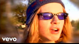 a person wearing sunglasses posing for the camera: Music video by Beck performing Loser. (C) 1993 Geffen Records