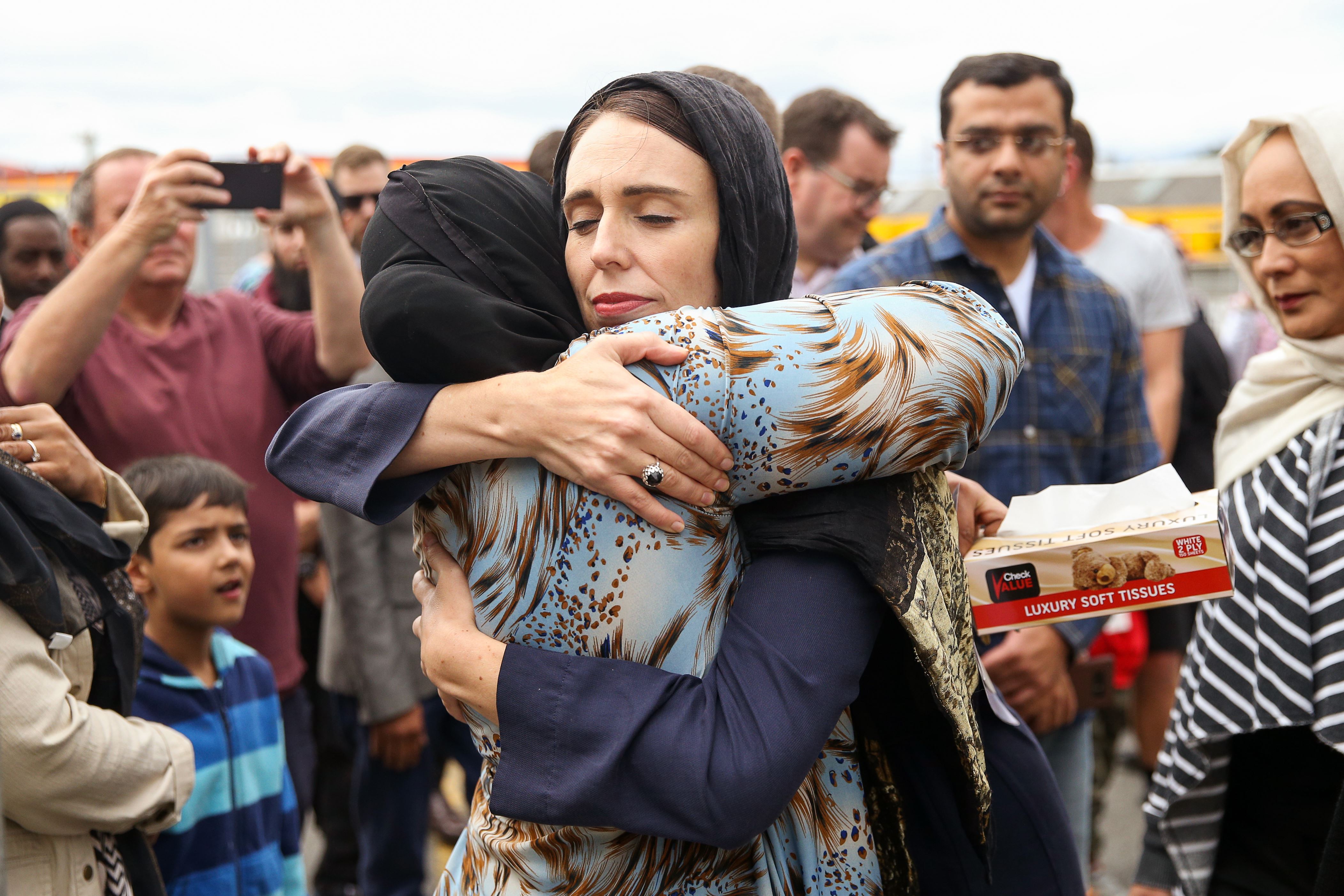 WELLINGTON, NEW ZEALAND - MARCH 17: Prime Minister Jacinda Ardern hugs a mosque-goer at the Kilbirnie Mosque on March 17, 2019 in Wellington, New Zealand. 50 people are confirmed dead and 36 are injured still in hospital following shooting attacks on two mosques in Christchurch on Friday, 15 March. The attack is the worst mass shooting in New Zealand's history. (Photo by /Getty Images)