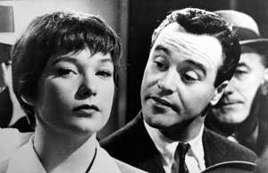 Shirley MacLaine, Jack Lemmon posing for the camera: An elevator operator (Shirley MacLaine) is the object of affection for a lonely office worker (Jack Lemmon) in Billy Wilder's 1960 film "The Apartment."