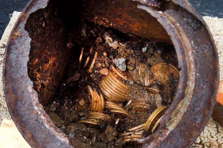 This image provided by the Saddle Ridge Hoard discoverers via Kagin&#39;s, Inc., shows one of the six decaying metal canisters filled with 1800s-era U.S. gold coins unearthed in California by two people who want to remain anonymous. The value of the "Saddle Ridge Hoard" treasure trove is estimated at $10 million or more.