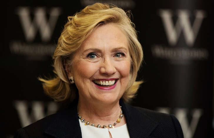Former U.S. Secretary of State Hillary Clinton smiles during a book signing for her book <em>Hard Choices</em> at a Waterstones book store in London July 3, 2014.