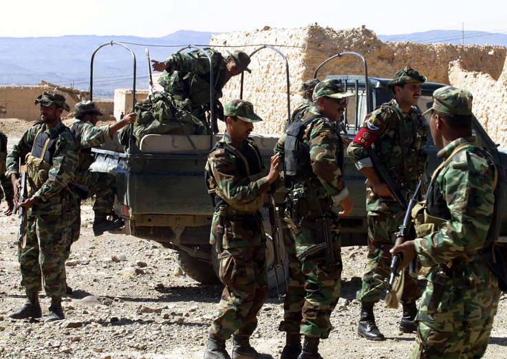 Commandos from Special Services Group, SSG of Pakistan army,  prepare to deploy to target areas from where operations against Al-Qaida and other militants in progress, Thursday, Oct 2, 2003 in Angore Adda, 1 kilometer from Pakitia province of Afghnaistan. The Pakistani army launched its largest-ever offensive against Al-Qaida and other militants in the border of Afghanistan on Thursday, killing at least 12 suspects and arresting 10, military officials said. (
