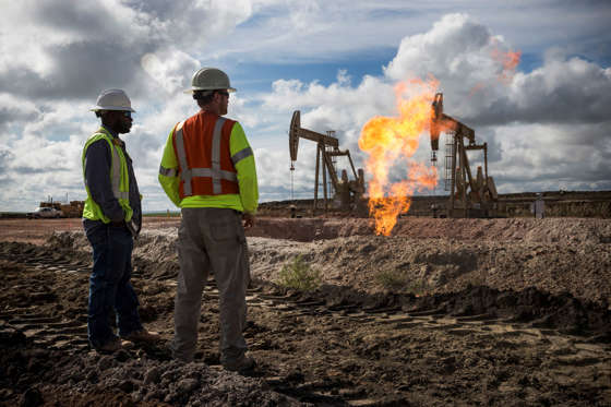 A gas flare is seen at an oil well site on July 26, 2013 outside Williston, North Dakota.